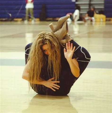 shakira legs|Shakira poses with her legs behind her head during intense.